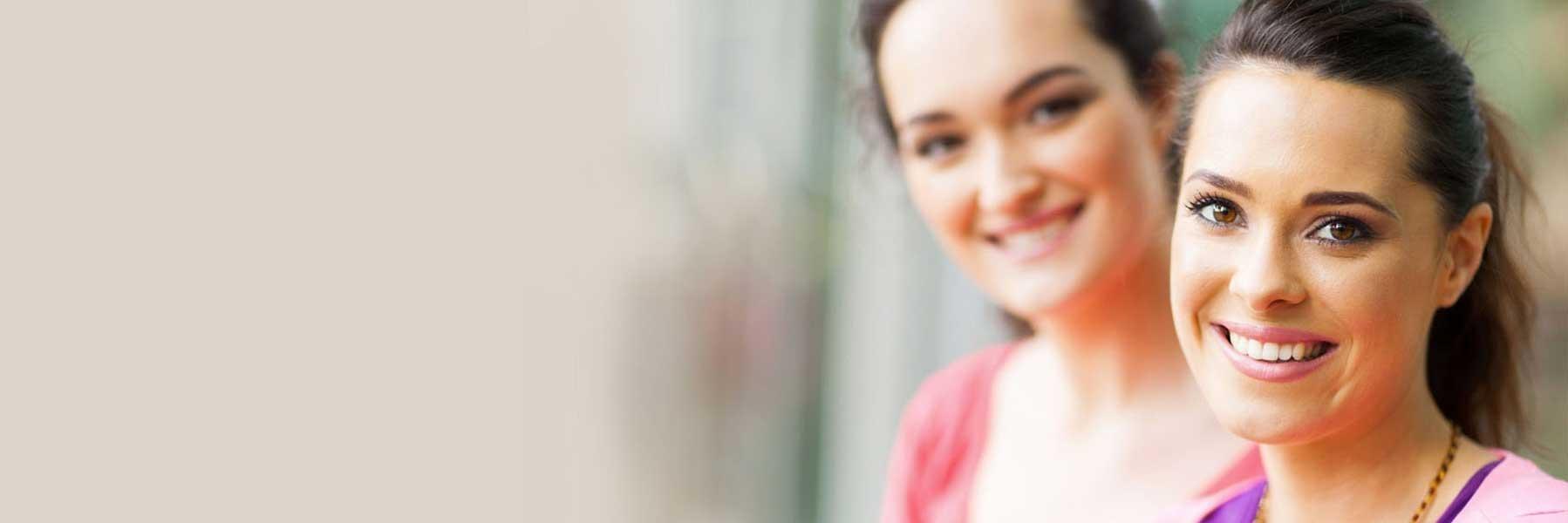 two women smiling outside l dentist 30080