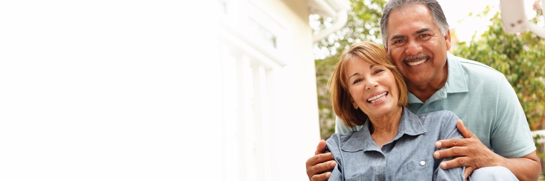 older couple hugging & smiling l cosmetic dentist smyrna ga
